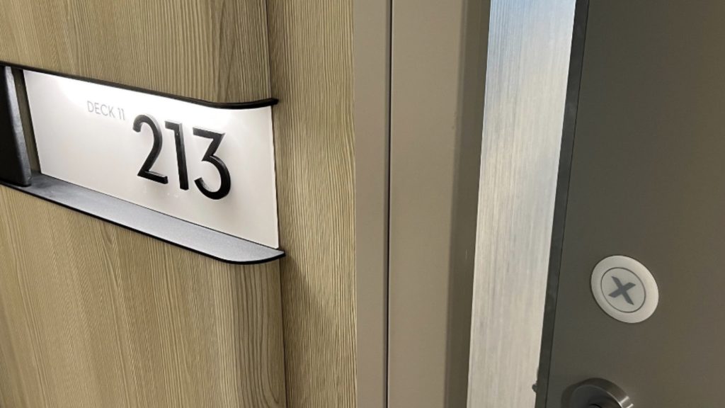 Room number of the Celebrity Beyond Sky Suite being reviewed, displayed outside the cabin's door. It is Cabin 11213.