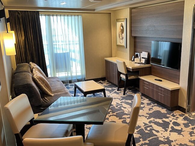 Living and dining area of forward-facing penthouse suite