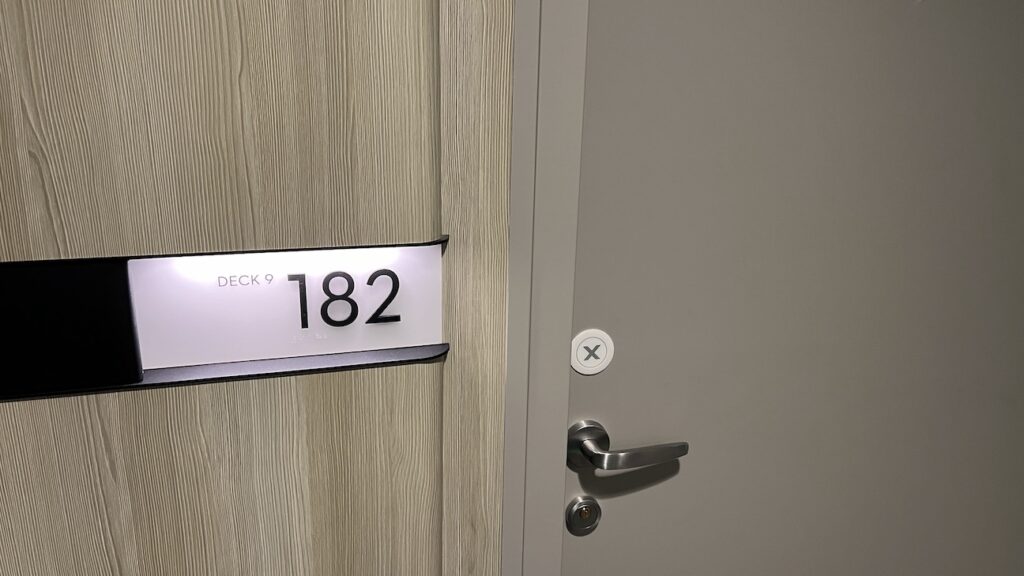 Sky Suite 9182 door sign on Celebrity Ascent, indicating the suite number in elegant font.