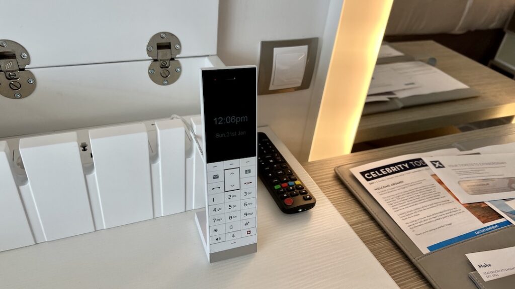 Close-up of the portable phone on the desk of the Celebrity Ascent Sky Suite.